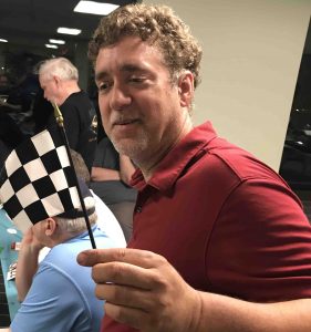 Richard White with the checkered flag